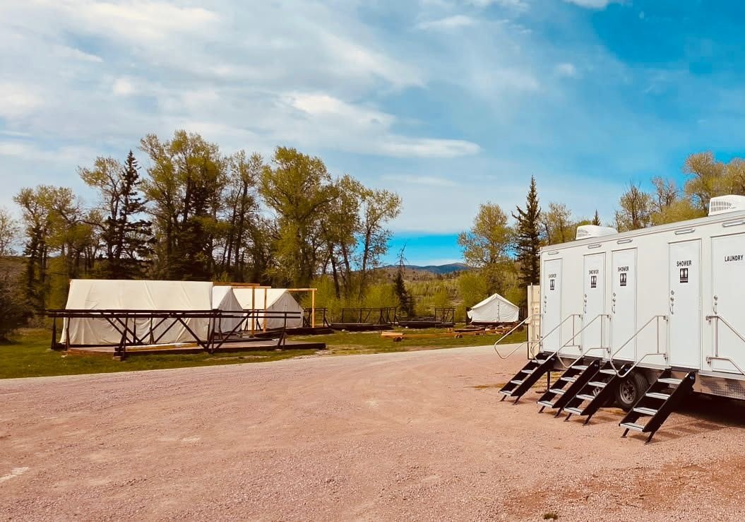 Base camp showers set up for a crew at a remote Utah staging area with no hookups