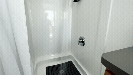 Looping tour inside a Utah shower trailer showing private shower stalls, vanity and finished interior